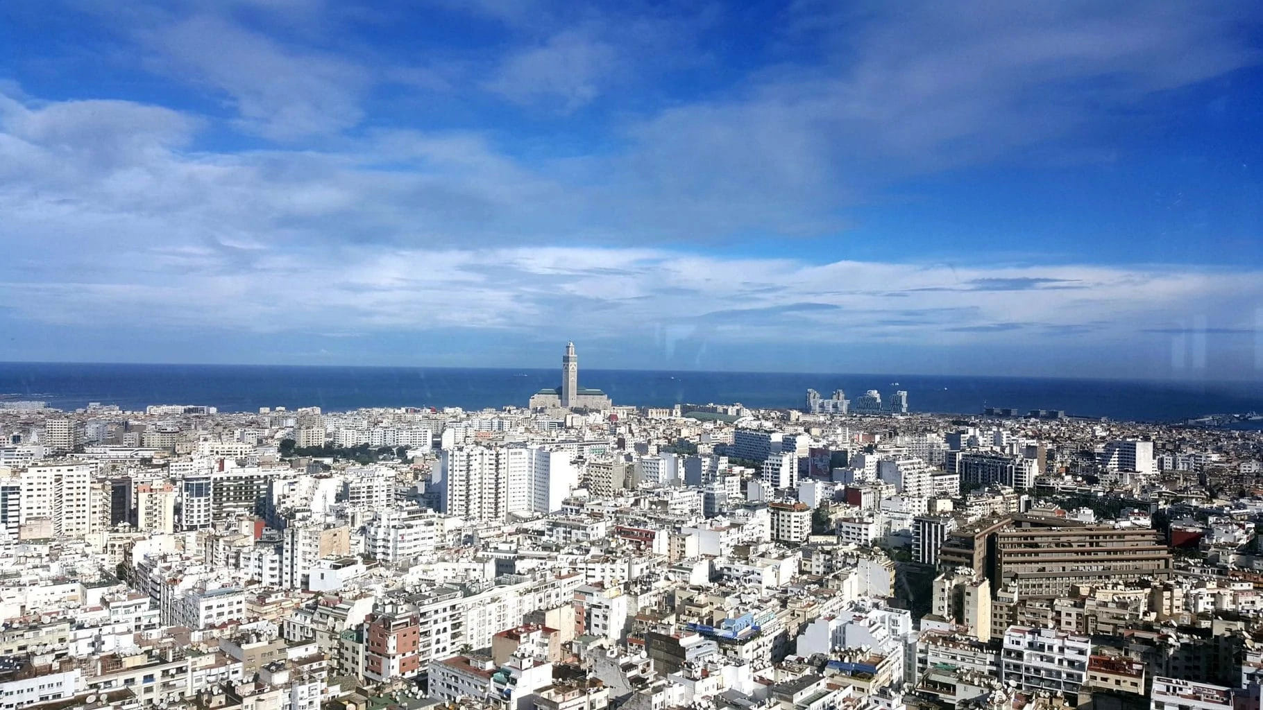 Panoramic view of Casablanca with the Hassan II Mosque and Atlantic Ocean